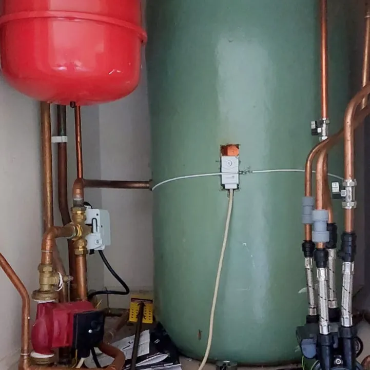 Belmont central heating system in an Aberdeen airing cupboard — copper pipework, expansion vessel and hot water cylinder